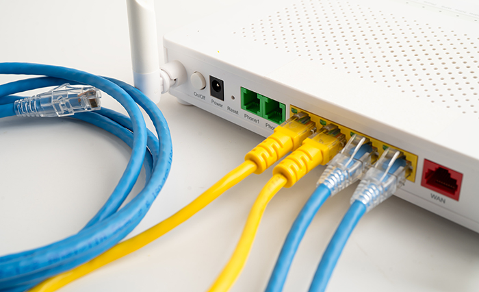 Ethernet cable with wireless router connect to internet service provider internet network.